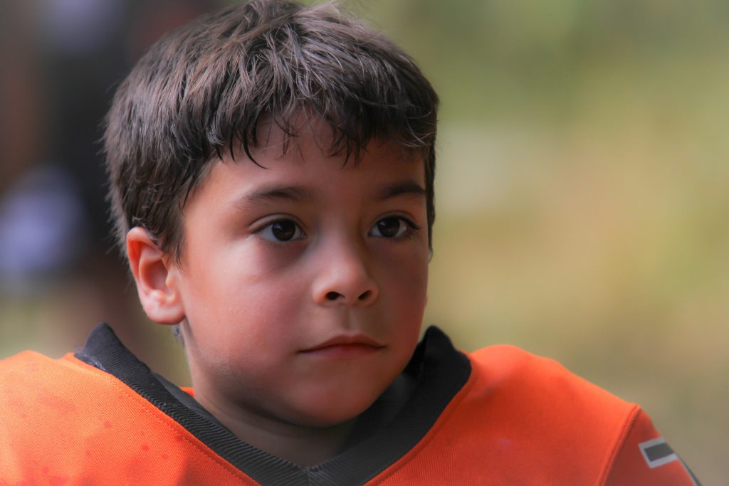 Youth Football Player without Helmet On